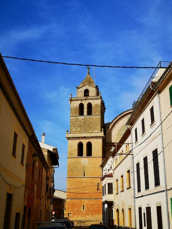 Tower of the Sant Julia church in Campos, Mallorca, with a figure of Saint Julian at the top of it.