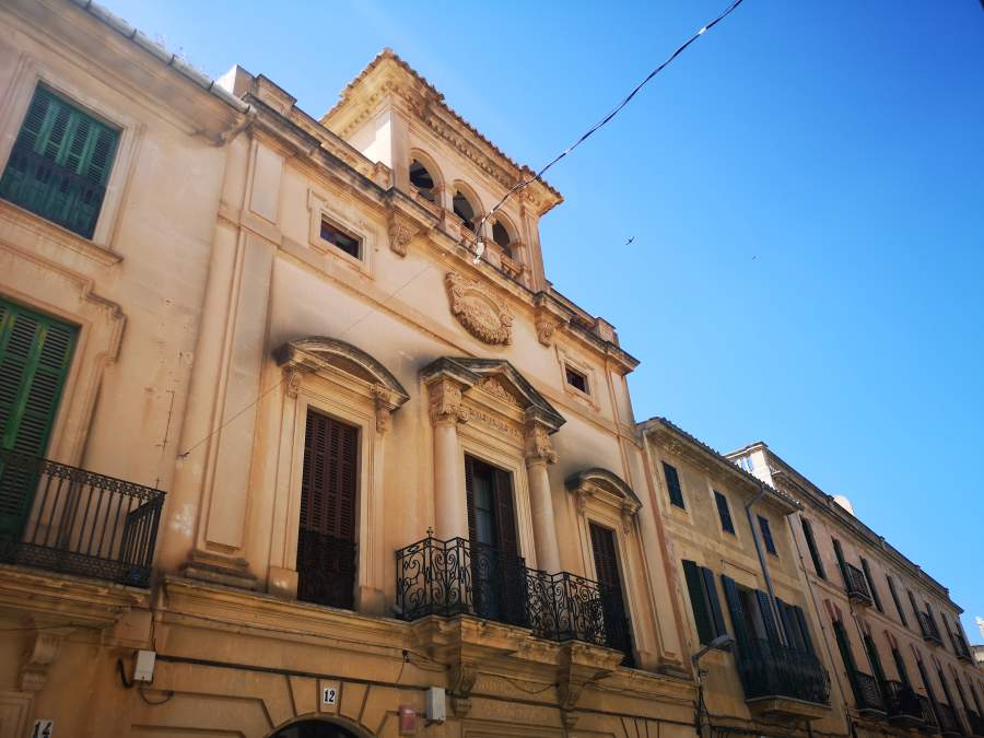 Beautiful Neoclassical facade of the Ca Xilenes building in Llucmajor town, Mallorca.