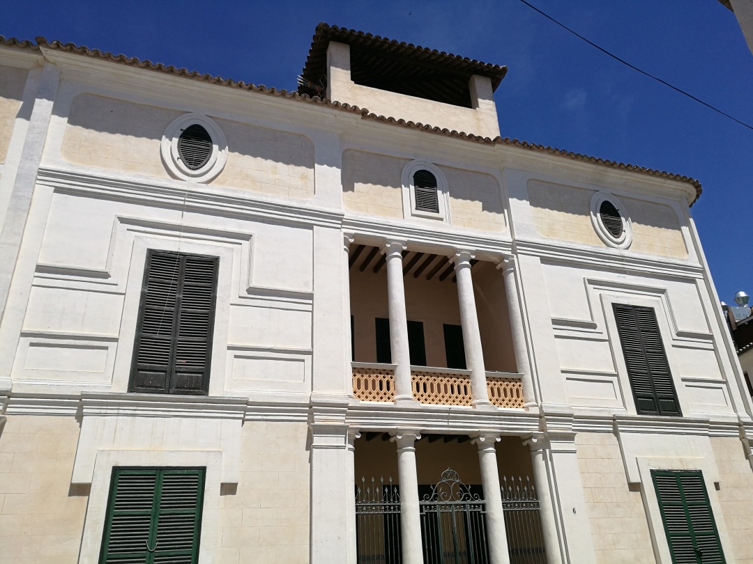 Neoclassical architecture facade on the mansion of Can Rafal Blanes in Arta town, Mallorca.