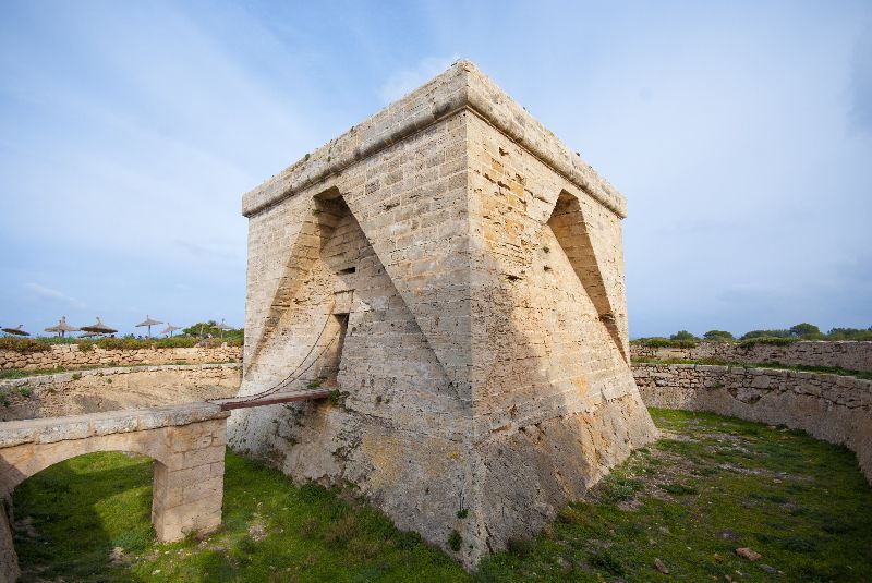 Notches in the outer walls of the Castell de sa Punta Amer fortress in Mallorca, Spain, that prevented enemies from climbing up.