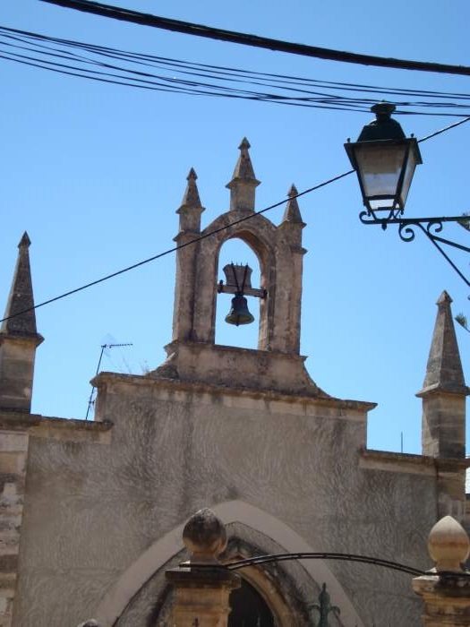Bell on the roof of Gothic style chapel of Saint Joseph in Sineu, Mallorca.