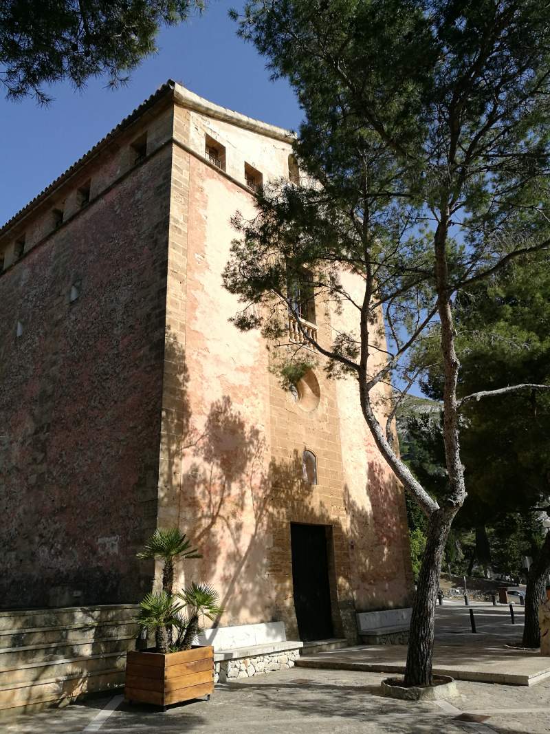 Ermita de Victoria hermitage and current hostel on the cliffs on the Alcanada headland in Mallorca.