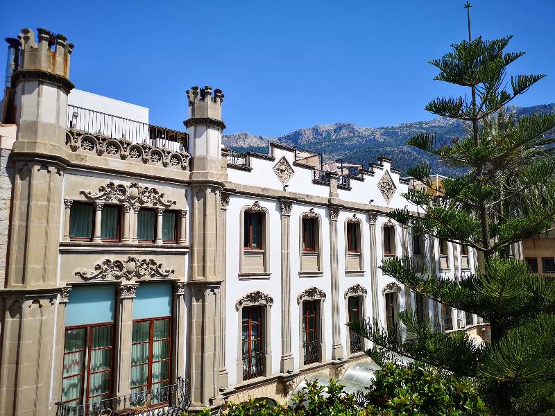 Facade of Gran Hotel Sóller, Mallorca, with a mix of Neo-Gothic and Modernism architecture.