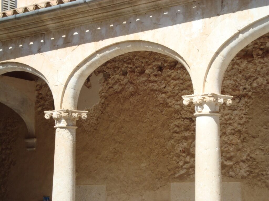 Columns with religious motifs in the cloister of the Minims convent in Sineu town, Mallorca.