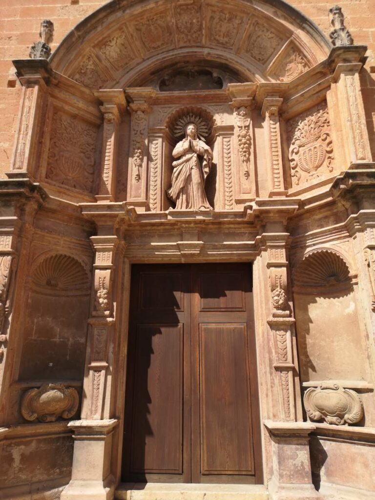 Baroque style entrance portal to the church of Sant Bonaventura in Llucmajor, Mallorca, with a motif of the Virgin Mary above it.