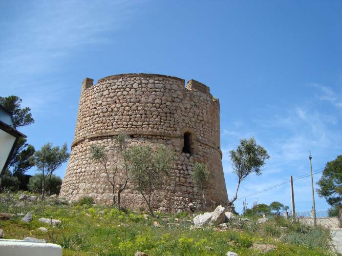 Old coastal watchtower of Sant Carles or Sa Mola, on the rocky cliffs over Port Andratx, Mallorca.