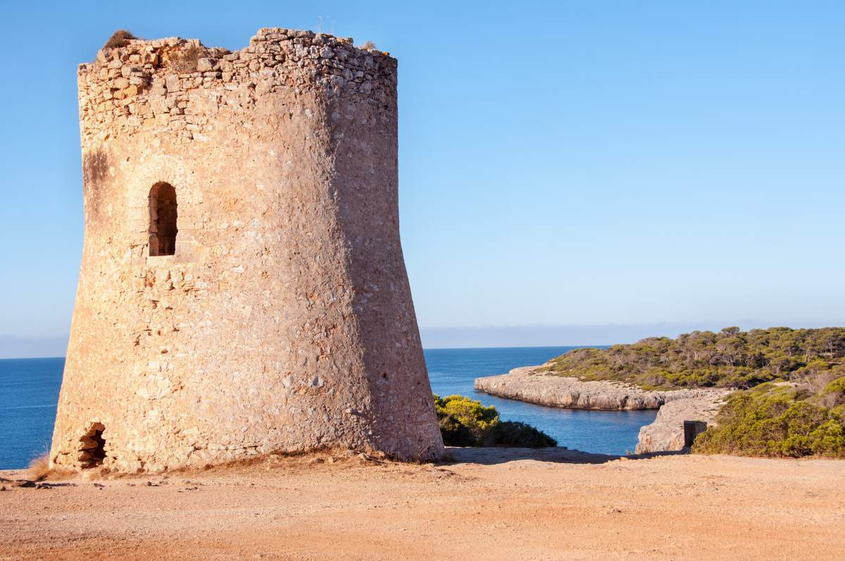 Old coastal watchtower of Cala Pi on the cliffs in Cala Pi, Llucmajor, Mallorca, Spain.