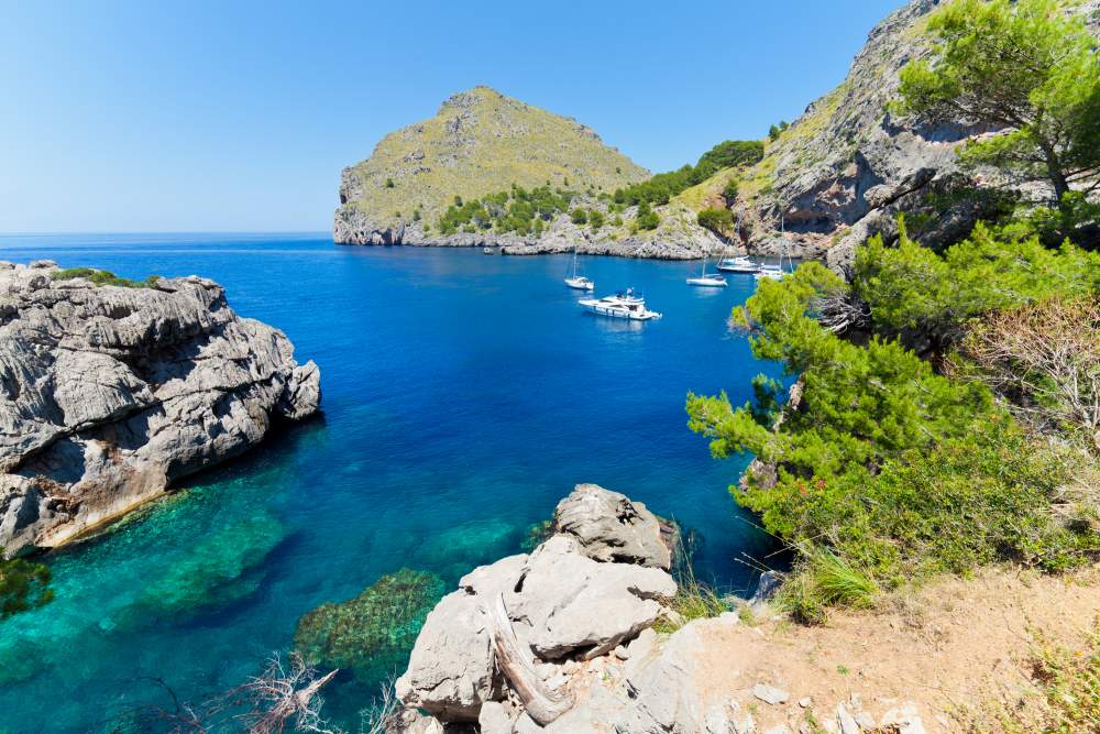 Picturesque cove of Port de Calobra by the coast of Tramuntana mountains in Mallorca.