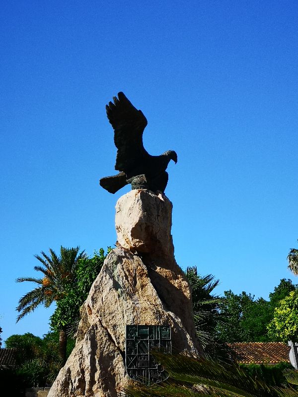 Sculpture of an eagle on the town square of Placa Carles V in Alcudia old town, Mallorca.