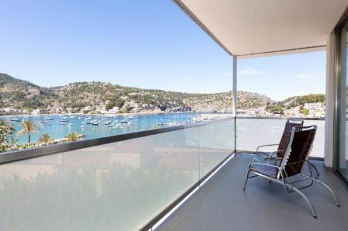 Balcony with sea views at Hotel Aimia in picturesque port de Sóller, Mallorca.