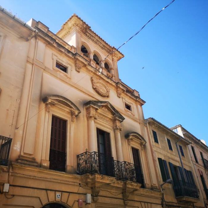 Beautiful Neoclassical facade of the Ca Xilenes building in Llucmajor town, Mallorca.