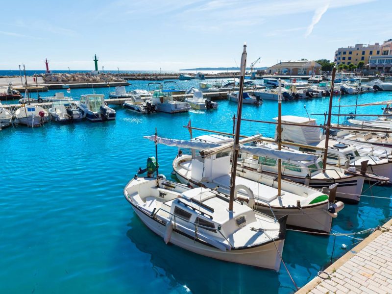 Boats anchored in the marina in Cala bona, Mallorca island, Spain.