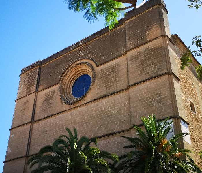 Front facade with entrance and rosette of the church of Nostra Senyora de la Consolació in Porreres village, Mallorca, Spain.