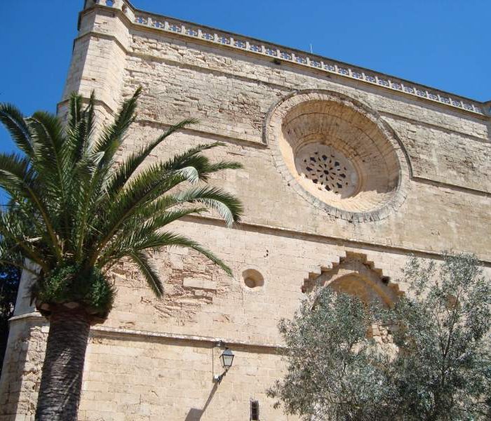 Main facade of the Sant Pere church in Petra, Mallorca, with beautiful rosette.