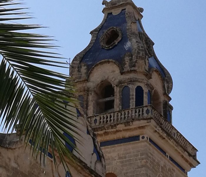 Artistic blue bellfry of the church of Santa Maria del Cami, Mallorca.
