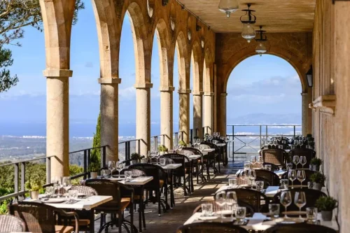Fantastic restaurant with tables under the old cloister at the Santuari de Cura monastery in Randa, Algaida, Mallorca.
