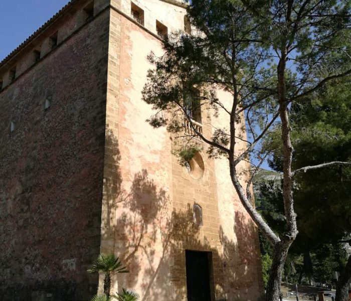 Ermita de Victoria hermitage and current hostel on the cliffs on the Alcanada headland in Mallorca.