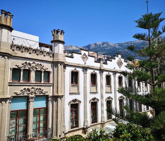 Facade of Gran Hotel Sóller, Mallorca, with a mix of Neo-Gothic and Modernism architecture.