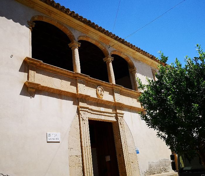 Facade of the rectory of Porreres village, with porch with arches, Mallorca.