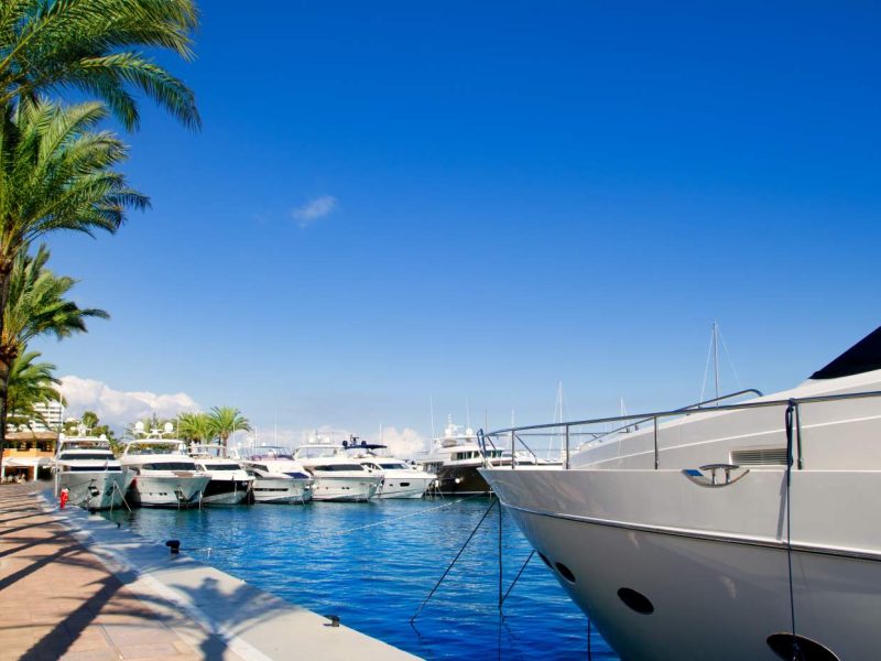 Luxury yachts and boats anchored at the marina in Portals Nous, Mallorca, Spain.
