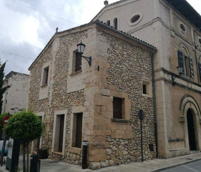 Facade with Regionalism architecture on the rectory building in Sant Llorenc des Cardassar village in Mallorca, Spain.