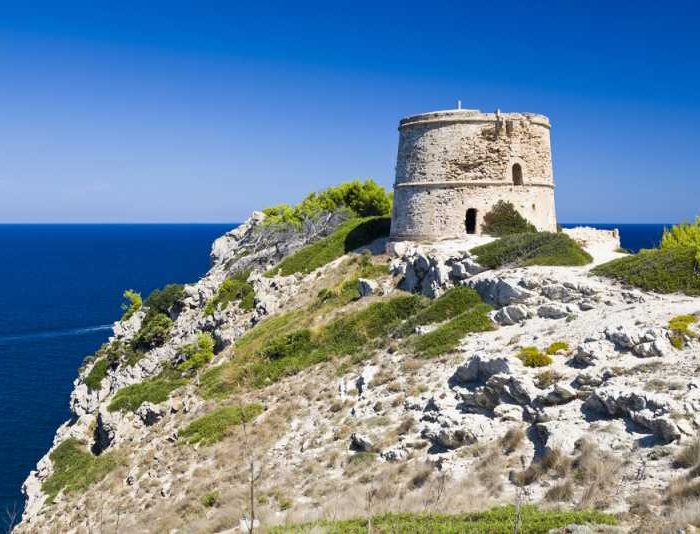 Old coastal watchtower of Torre Albarca on the cliffs of the Llevant mountain range, Mallorca island, Spain.