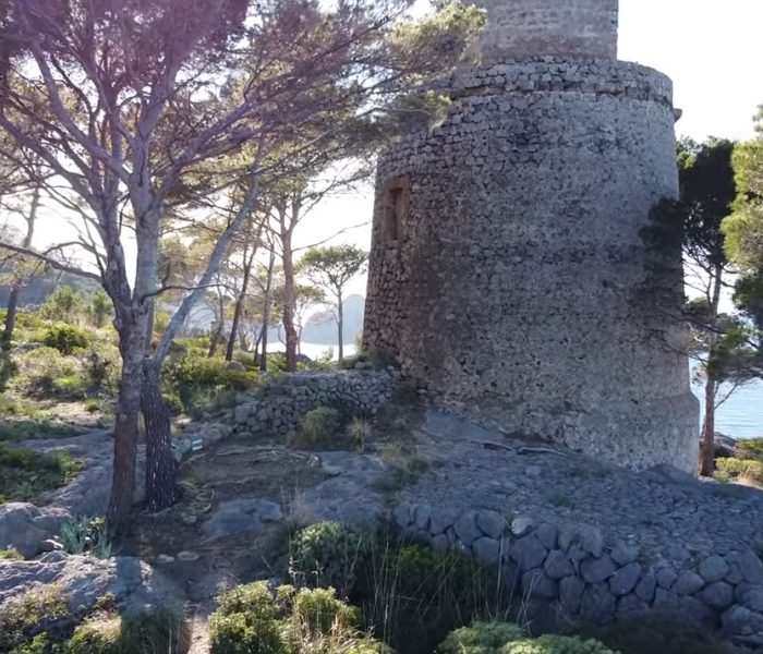Old coastal watchtower of Torre de sa Pedrissa on the cliffs near Cala Deia, Mallorca.