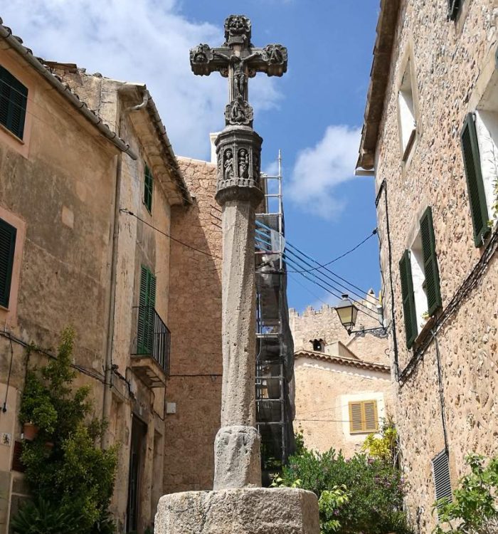 Stone cross dividing the streets in Valldemossa town, Mallorca.
